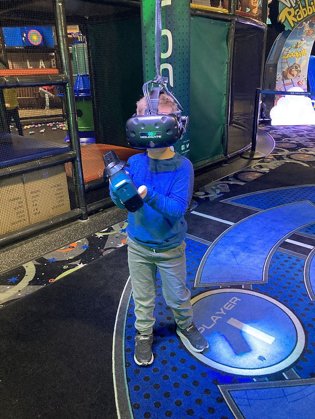 kids enjoying virtual reality games at the fun lab