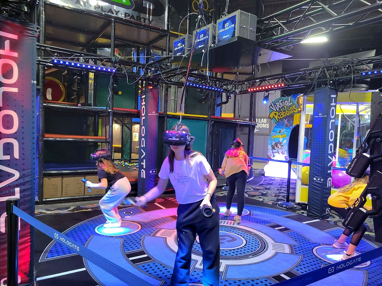 kids and adults playing vex vr at the fun lab