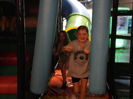 Kids celebrating a summer birthday party at The Fun Lab in Blaine with arcade games and attractions