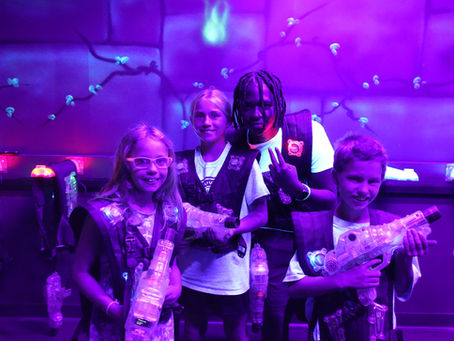 Children celebrating a birthday party with friends at The Fun Lab in Blaine, MN