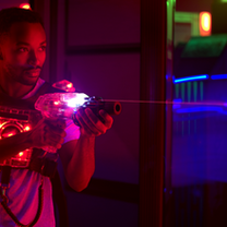 Kids aiming lasers in The Fun Lab’s high-energy laser tag arena in Blaine, MN.