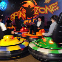 Guests spinning and laughing in bumper cars at The Fun Lab's Spin Zone in Blaine, MN