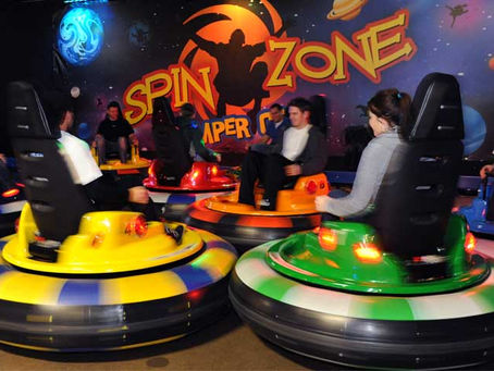 Kids celebrating a birthday party with arcade games and attractions at The Fun Lab in Blaine, MN