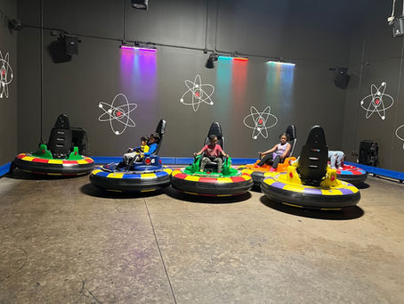 kids having fun on the bumper cars at the fun lab