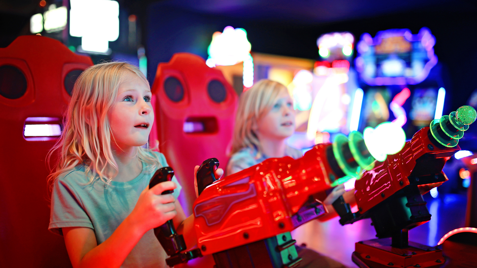 kids playing arcade games at the fun lab