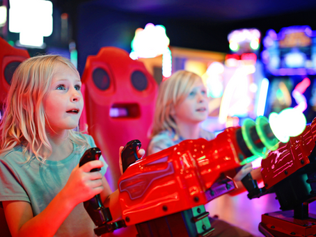 girls playing arcade games at the fun lab in blaine mn