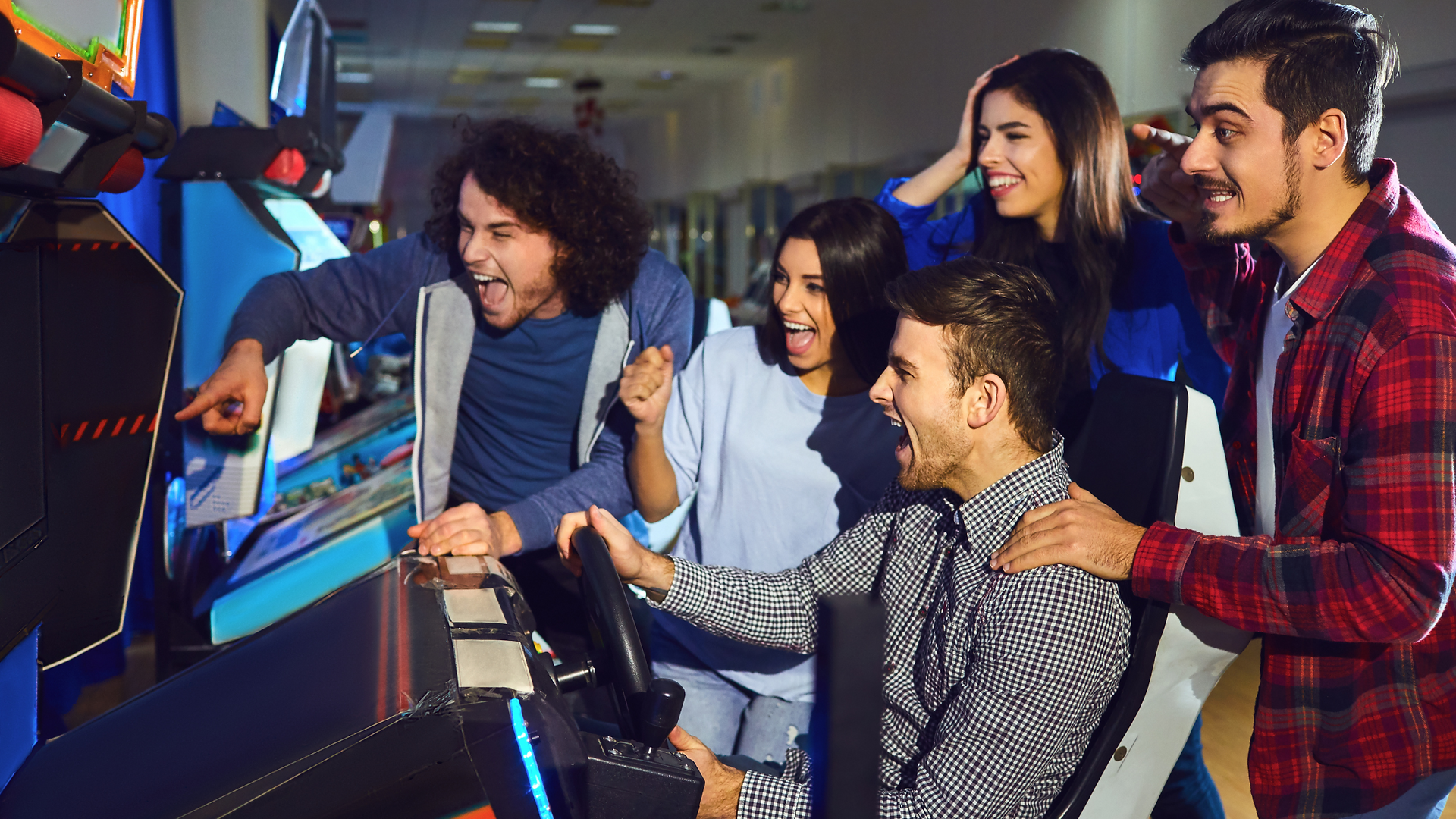 adults playing arcade games 