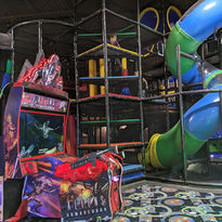 Kids' play area with arcade game and slide