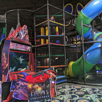 Kids tackling a ninja obstacle course at The Fun Lab in Blaine, MN.