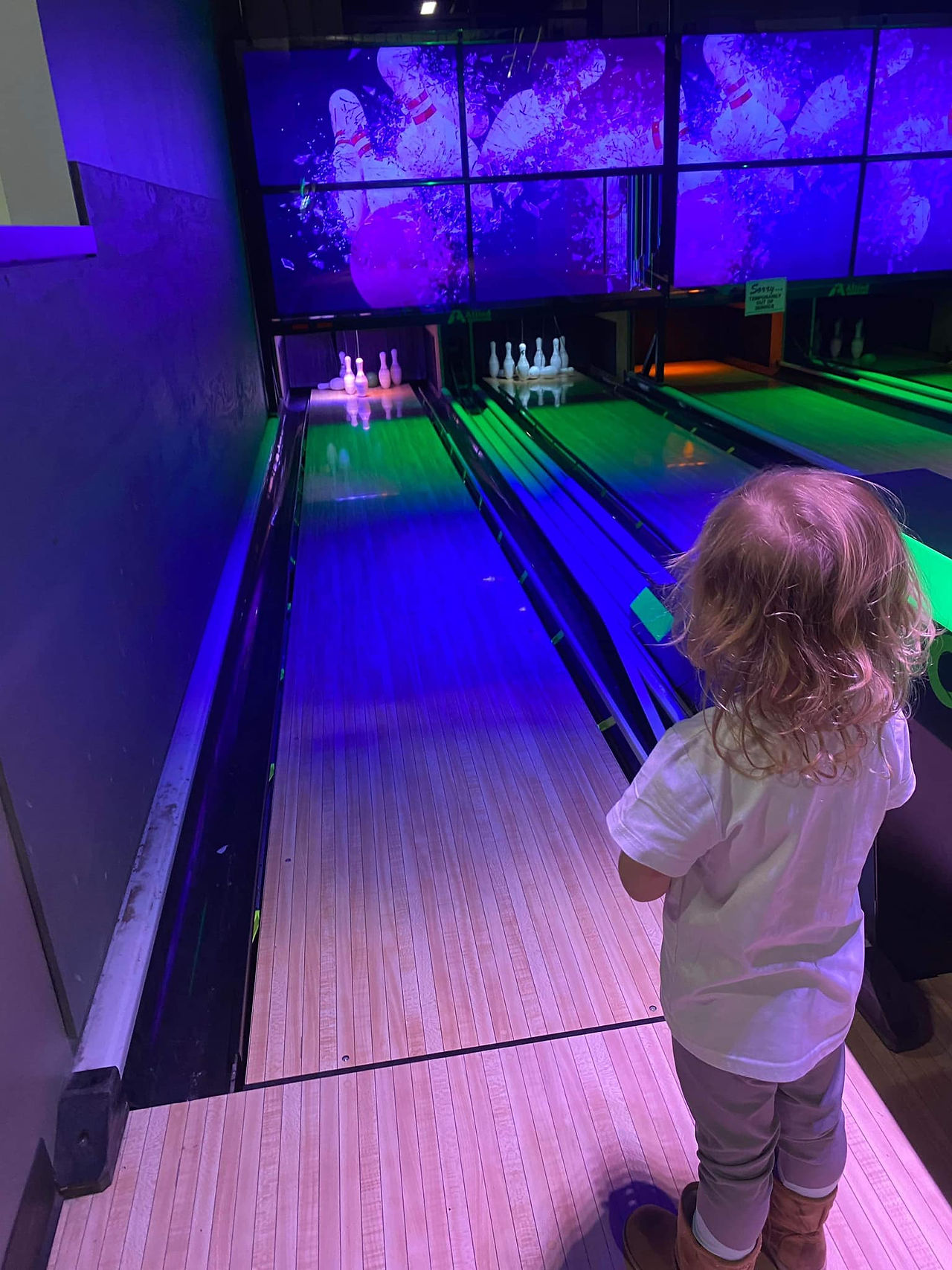 toddler girl mini bowling at the fun lab