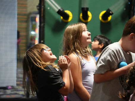 Kids celebrating a birthday party at The Fun Lab in Blaine MN with games and attractions